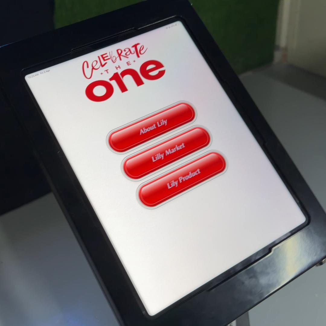 AI kiosk at an event features a digital display of a ai hologram woman in a blue hijab